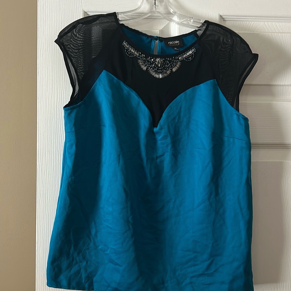 Beautiful color blue with sheer black and beaded neck area